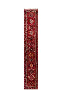 Lot 64 - A fine very long Heriz runner, north-west Persia, approx: 772cm. x 91cm