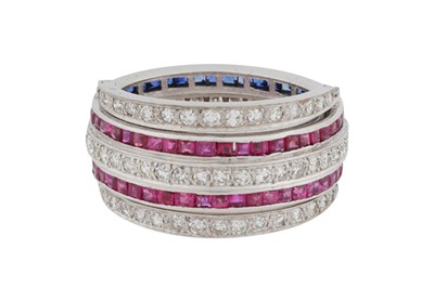Lot 142 - A ruby, sapphire and diamond swivel ring