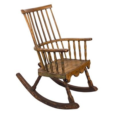 Lot 289 - An English Vernacular oak and walnut comb-back rocking chair