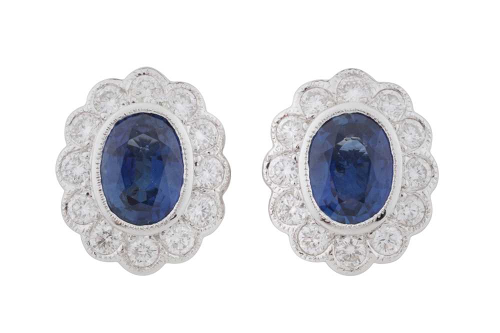Lot 70 - A pair of sapphire and diamond stud earrings