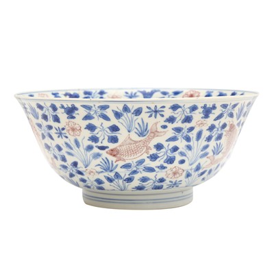 Lot 12 - A Chinese blue and white and copper-red 'fish' bowl, Qing dynasty, Kangxi period