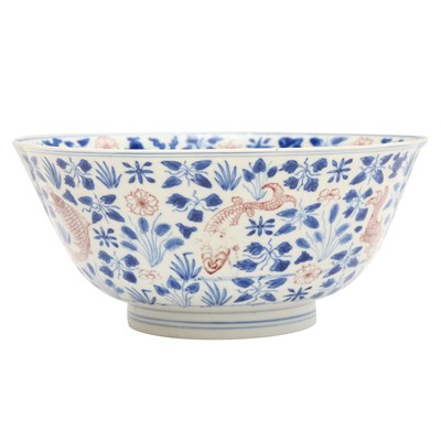 Lot 12 - A Chinese blue and white and copper-red 'fish' bowl, Qing dynasty, Kangxi period
