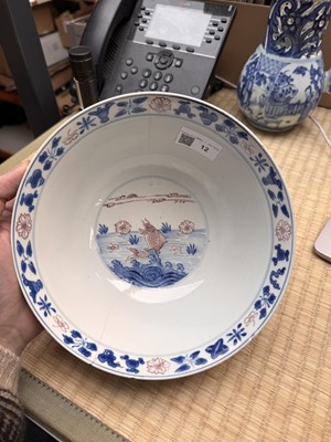 Lot 12 - A Chinese blue and white and copper-red 'fish' bowl, Qing dynasty, Kangxi period