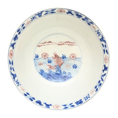 Lot 12 - A Chinese blue and white and copper-red 'fish' bowl, Qing dynasty, Kangxi period