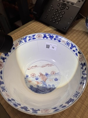 Lot 12 - A Chinese blue and white and copper-red 'fish' bowl, Qing dynasty, Kangxi period