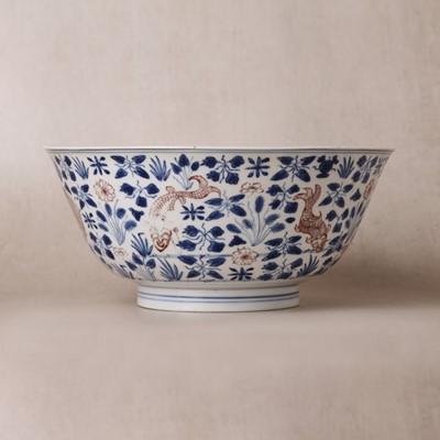 Lot 12 - A Chinese blue and white and copper-red 'fish' bowl, Qing dynasty, Kangxi period