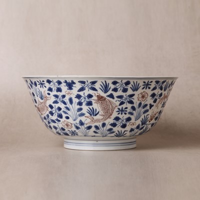 Lot 12 - A Chinese blue and white and copper-red 'fish' bowl, Qing dynasty, Kangxi period