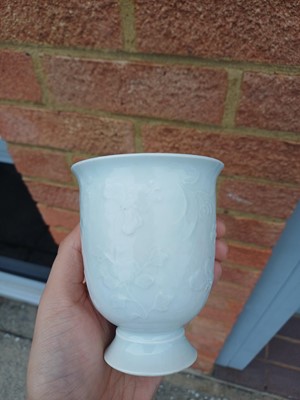 Lot 4 - A Chinese blanc-de-chine relief-decorated cup, Qing dynasty, Kangxi period