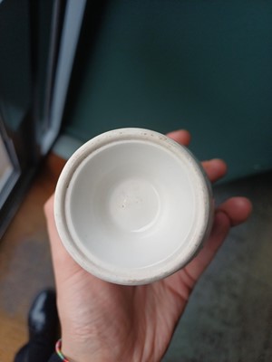 Lot 4 - A Chinese blanc-de-chine relief-decorated cup, Qing dynasty, Kangxi period