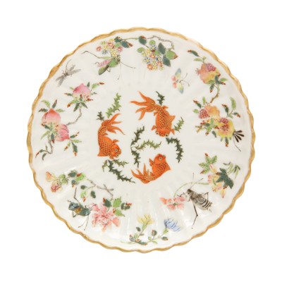 Lot 262 - A Chinese famille-rose foliate saucer, Qing dynasty, Daoguang mark and of the period