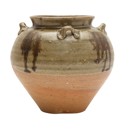 Lot 121 - A Chinese celadon-glazed jar, Tang dynasty