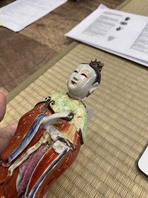 Lot 73 - A rare Chinese famille-rose 'Court Lady' candle holder, Qing dynasty, Qianlong period