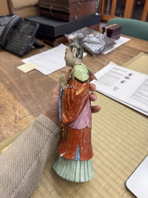 Lot 73 - A rare Chinese famille-rose 'Court Lady' candle holder, Qing dynasty, Qianlong period