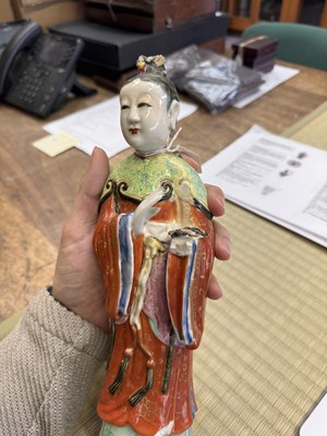 Lot 73 - A rare Chinese famille-rose 'Court Lady' candle holder, Qing dynasty, Qianlong period