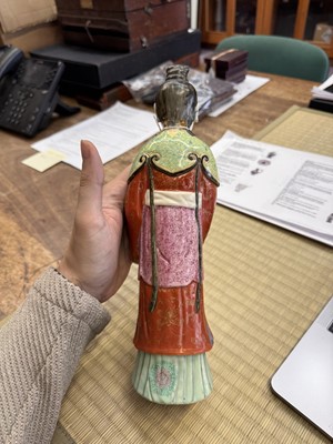 Lot 73 - A rare Chinese famille-rose 'Court Lady' candle holder, Qing dynasty, Qianlong period