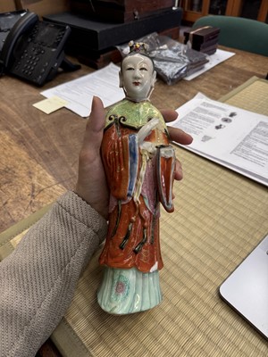 Lot 73 - A rare Chinese famille-rose 'Court Lady' candle holder, Qing dynasty, Qianlong period