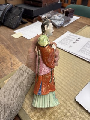 Lot 73 - A rare Chinese famille-rose 'Court Lady' candle holder, Qing dynasty, Qianlong period