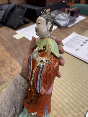 Lot 73 - A rare Chinese famille-rose 'Court Lady' candle holder, Qing dynasty, Qianlong period