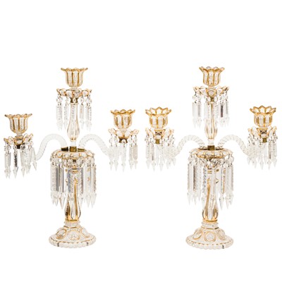 Lot 113 - In the manner of Baccarat, a pair of of glass hurricane candelabra
