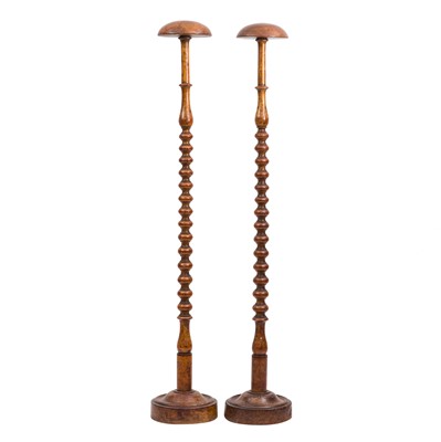 Lot 455 - A pair of Victorian walnut wig stands