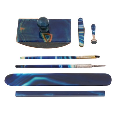 Lot 549 - An early 20th century banded blue agate desk set, circa 1910
