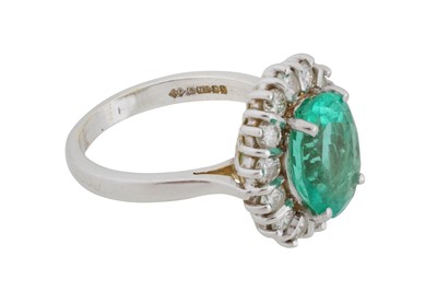 Lot 108 - An emerald and diamond halo ring, circa 1997