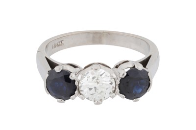 Lot 75 - A diamond and sapphire three-stone ring
