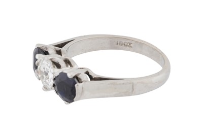 Lot 75 - A diamond and sapphire three-stone ring