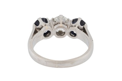 Lot 75 - A diamond and sapphire three-stone ring
