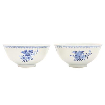 Lot 270 - A pair of Chinese blue and white 'blossoms' bowls, Qing dynasty, Guangxu marks and of the period