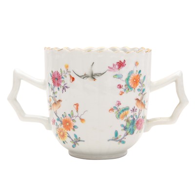 Lot 495 - A Chinese export famille-rose chocolate cup and saucer, Qing dynasty, 19th century