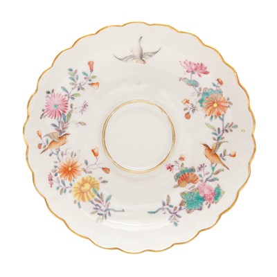 Lot 495 - A Chinese export famille-rose chocolate cup and saucer, Qing dynasty, 19th century