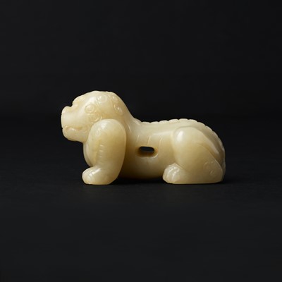 Lot 85 - A Chinese celadon jade carving of a lion, Qing Dynasty, 18th/19th century