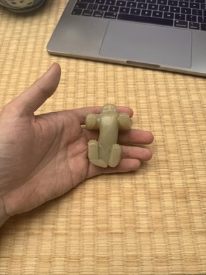 Lot 85 - A Chinese celadon jade carving of a lion, Qing Dynasty, 18th/19th century