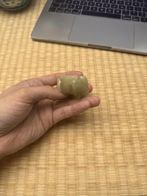 Lot 85 - A Chinese celadon jade carving of a lion, Qing Dynasty, 18th/19th century