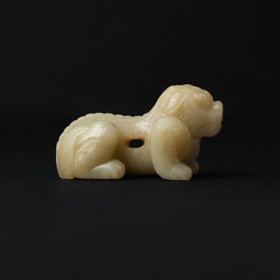 Lot 85 - A Chinese celadon jade carving of a lion, Qing Dynasty, 18th/19th century