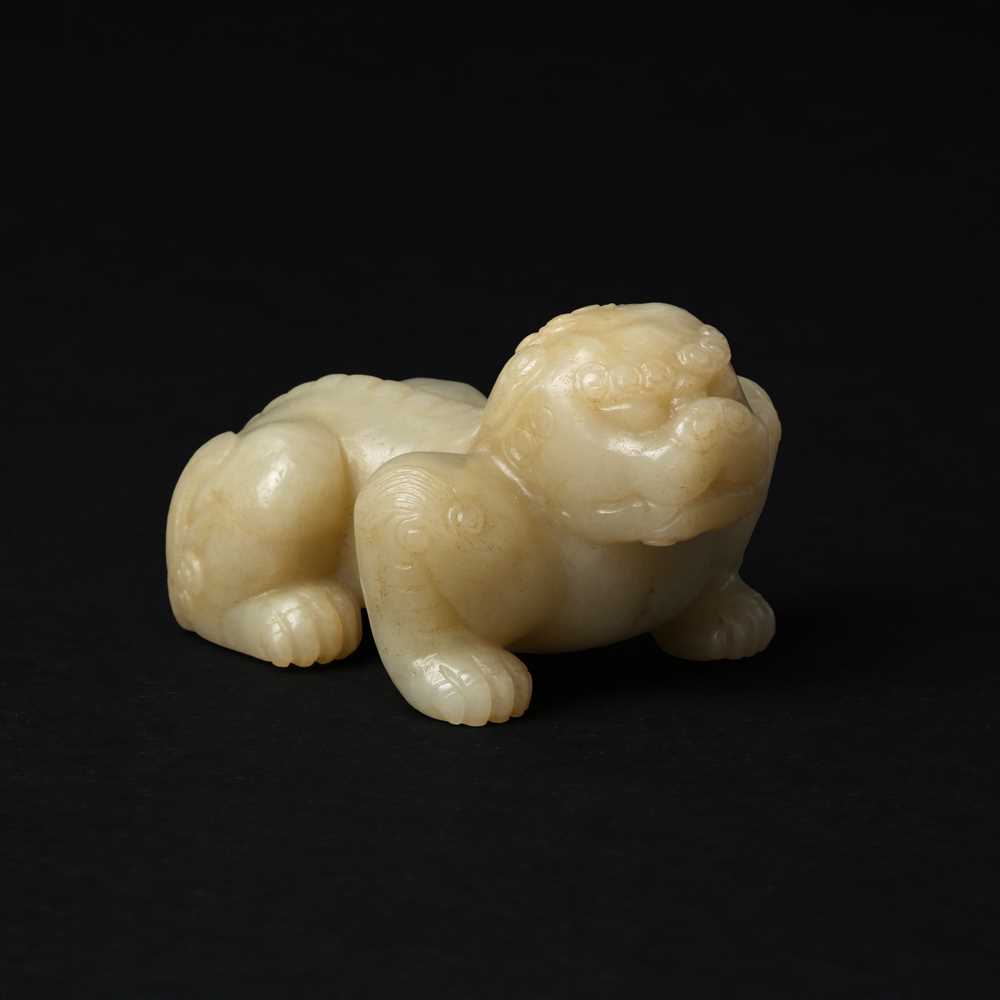 Lot 85 - A Chinese celadon jade carving of a lion, Qing Dynasty, 18th/19th century