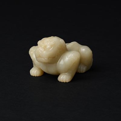Lot 85 - A Chinese celadon jade carving of a lion, Qing Dynasty, 18th/19th century
