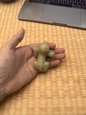 Lot 85 - A Chinese celadon jade carving of a lion, Qing Dynasty, 18th/19th century