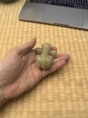 Lot 85 - A Chinese celadon jade carving of a lion, Qing Dynasty, 18th/19th century