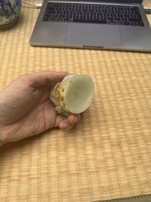 Lot 81 - A Chinese Yuan-style pale-celadon jade finial, 20th century