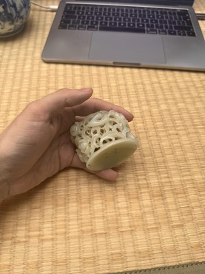 Lot 81 - A Chinese Yuan-style pale-celadon jade finial, 20th century