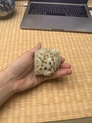 Lot 81 - A Chinese Yuan-style pale-celadon jade finial, 20th century