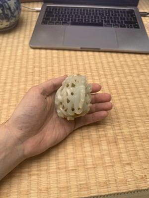 Lot 81 - A Chinese Yuan-style pale-celadon jade finial, 20th century