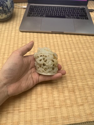 Lot 81 - A Chinese Yuan-style pale-celadon jade finial, 20th century