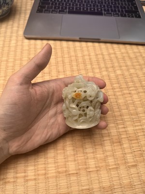 Lot 81 - A Chinese Yuan-style pale-celadon jade finial, 20th century