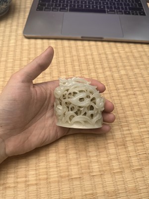 Lot 81 - A Chinese Yuan-style pale-celadon jade finial, 20th century