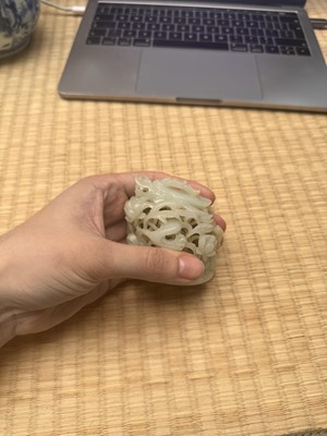 Lot 81 - A Chinese Yuan-style pale-celadon jade finial, 20th century