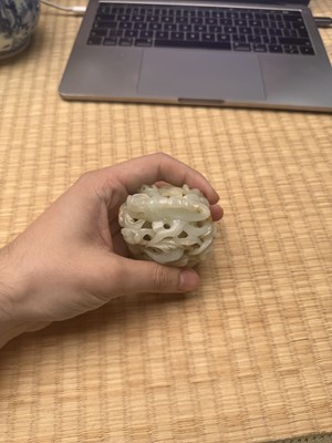 Lot 81 - A Chinese Yuan-style pale-celadon jade finial, 20th century