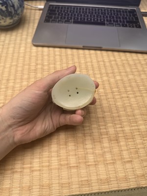 Lot 81 - A Chinese Yuan-style pale-celadon jade finial, 20th century